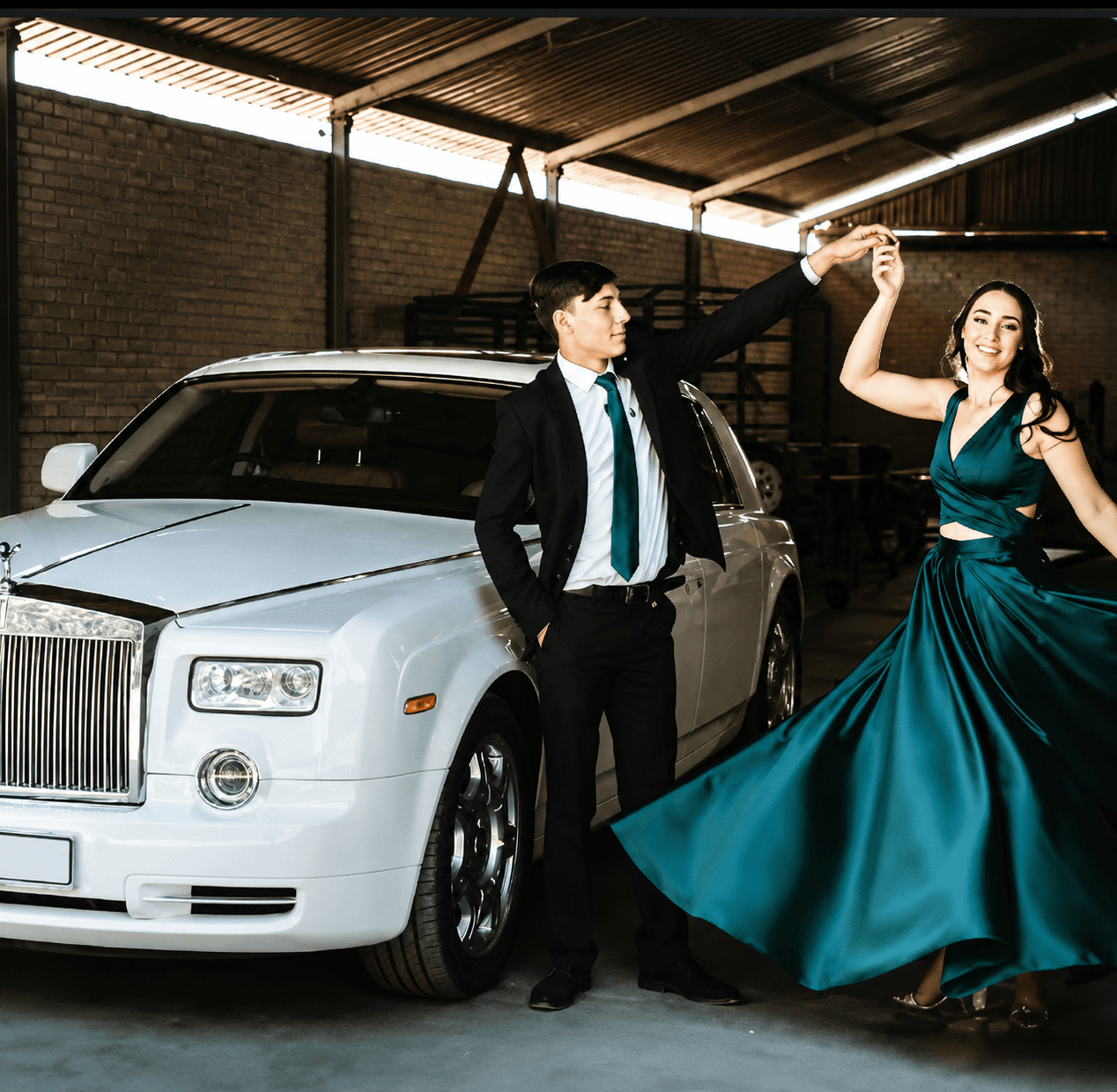 Couple with Just Coach Hire prom transport vehicle Couple with Just Coach Hire prom transport vehicle